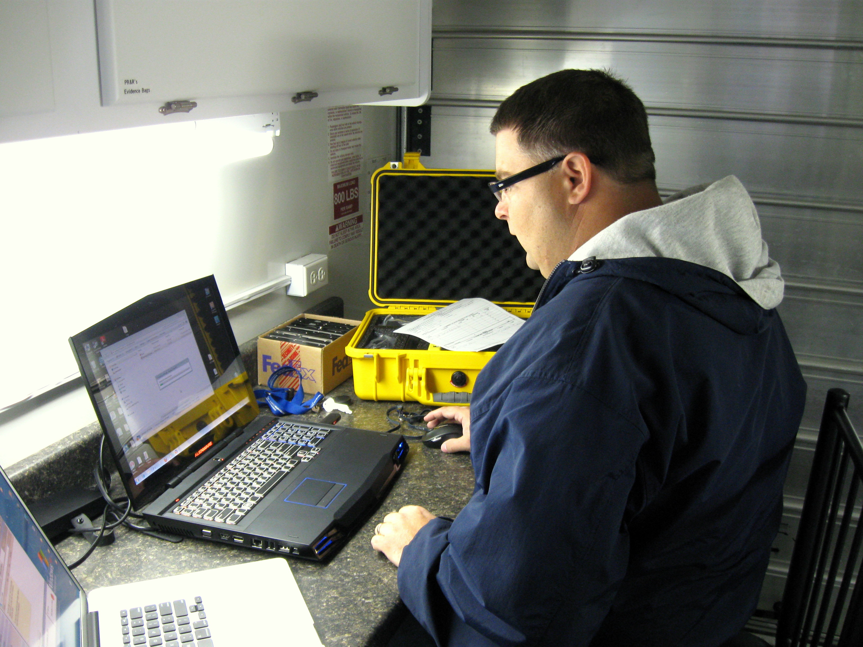 2010-10-01 Sgt. Jeremy Chapman, Cyber Crimes, conducts a computer search